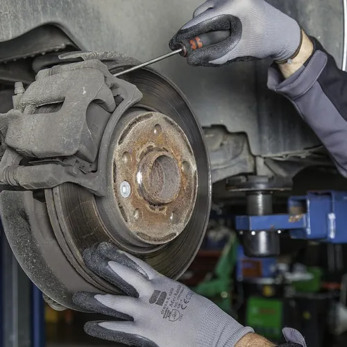 brake disc and wheel assembly in auto repair shop workshop
