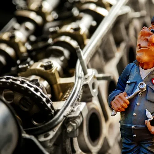 mechanic checking car at auto repair shop
