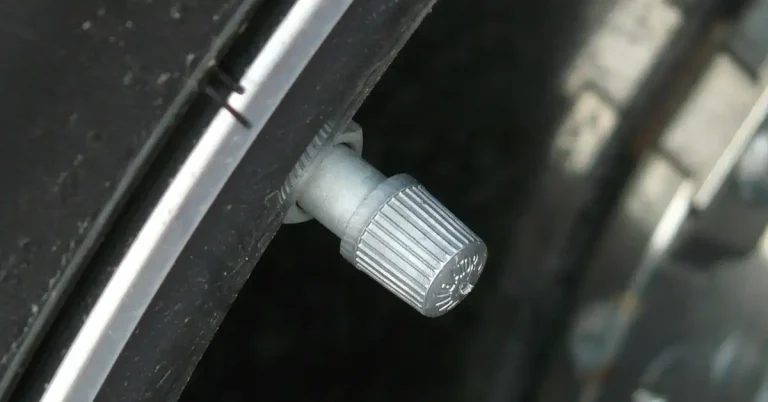 car tire valve stem for checking PSI inflation pressure