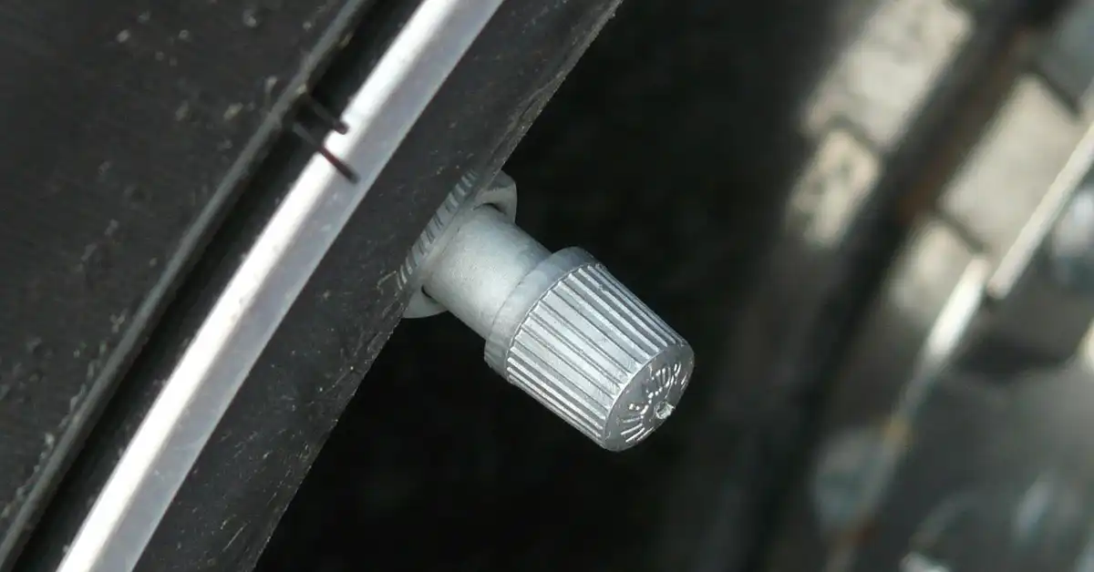 car tire valve stem for checking PSI inflation pressure
