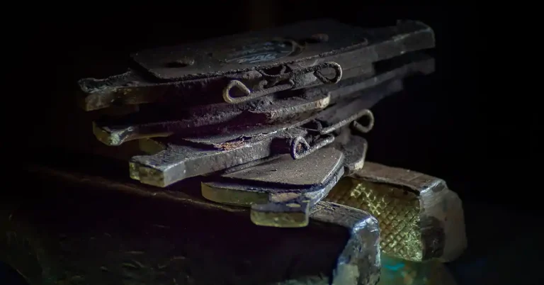 worn car brake pad and disc close-up