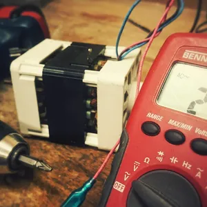 Digital multimeter for testing alternator output voltage