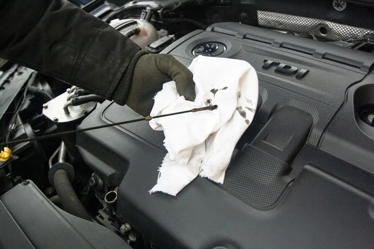 Ford crossover beside service receipts and a calculator in a driveway