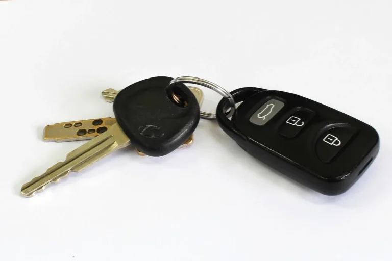 First-time car buyer compares two compact cars with a checklist on a quiet street