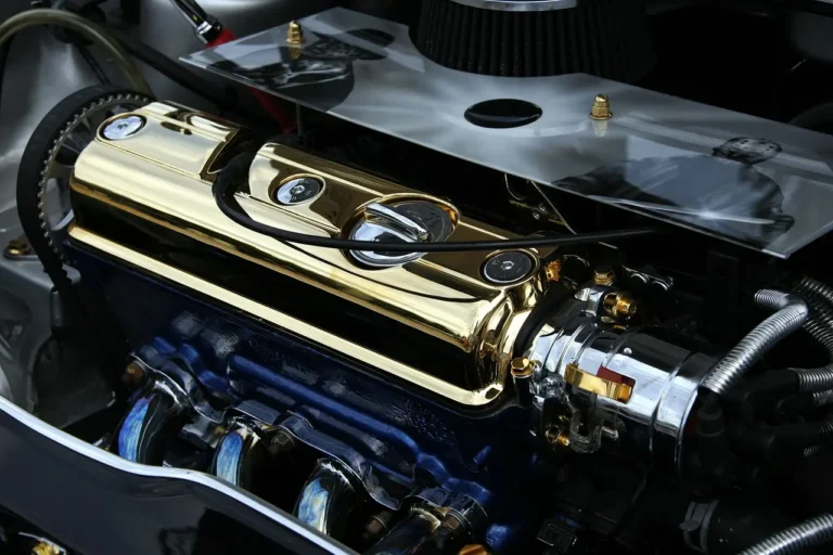 Driveway mechanic inspecting a sedan engine bay and key fob as the car starts then dies immediately.