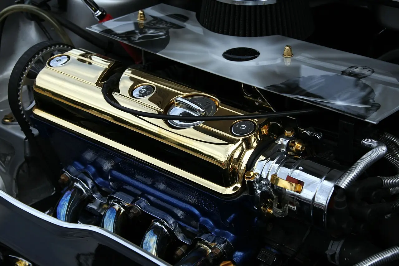 Driveway mechanic inspecting a sedan engine bay and key fob as the car starts then dies immediately.