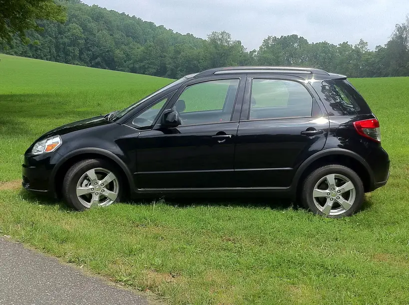 Rear child seat installed in a crossover back seat with anchors and seat belt visible
