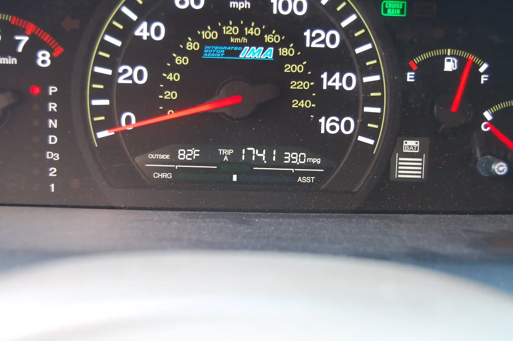 Chevy models with the best fuel economy right now shown as a compact sedan and crossover on a sunny street