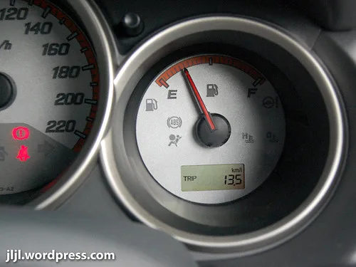 Close-up of a Chevrolet dashboard fuel-economy display and controls