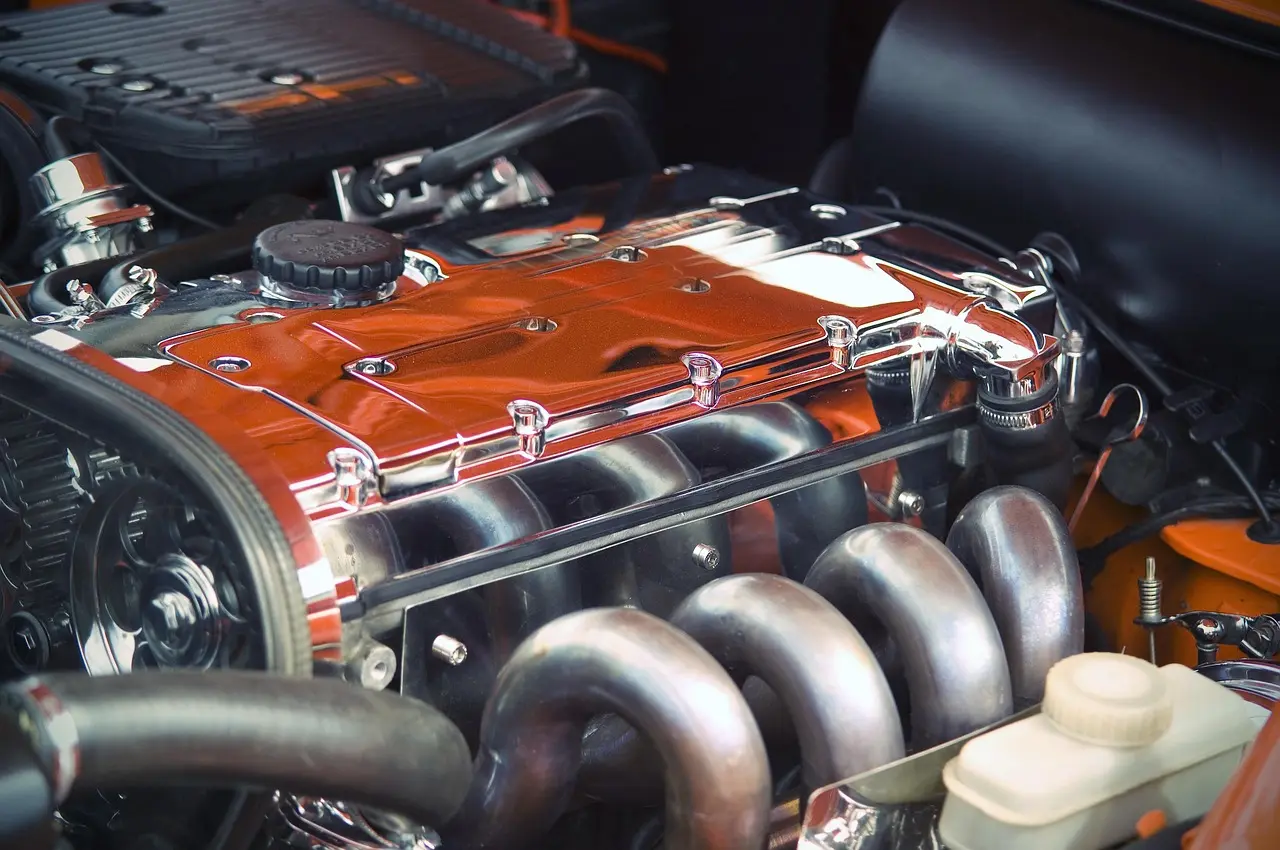 What is the difference between an engine block and a cylinder head?