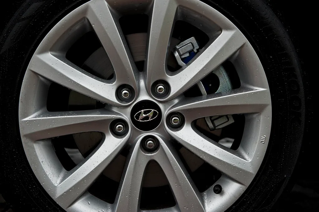 Close-up of a Honda Civic tire tread depth gauge measuring tread wear