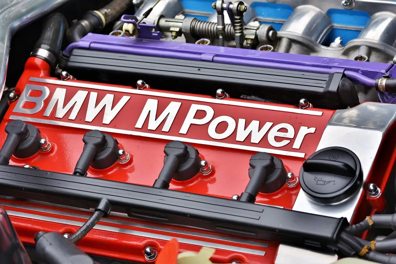 Open car hood with engine components visible for under-the-hood identification